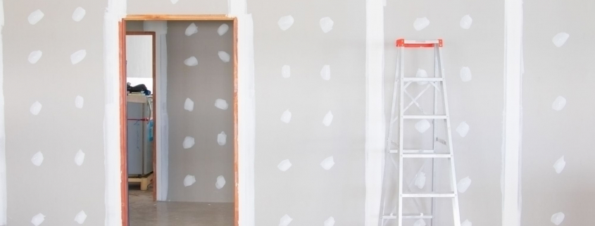 stair and gypsum board wall interior decoration of home at construction site with copy space add text